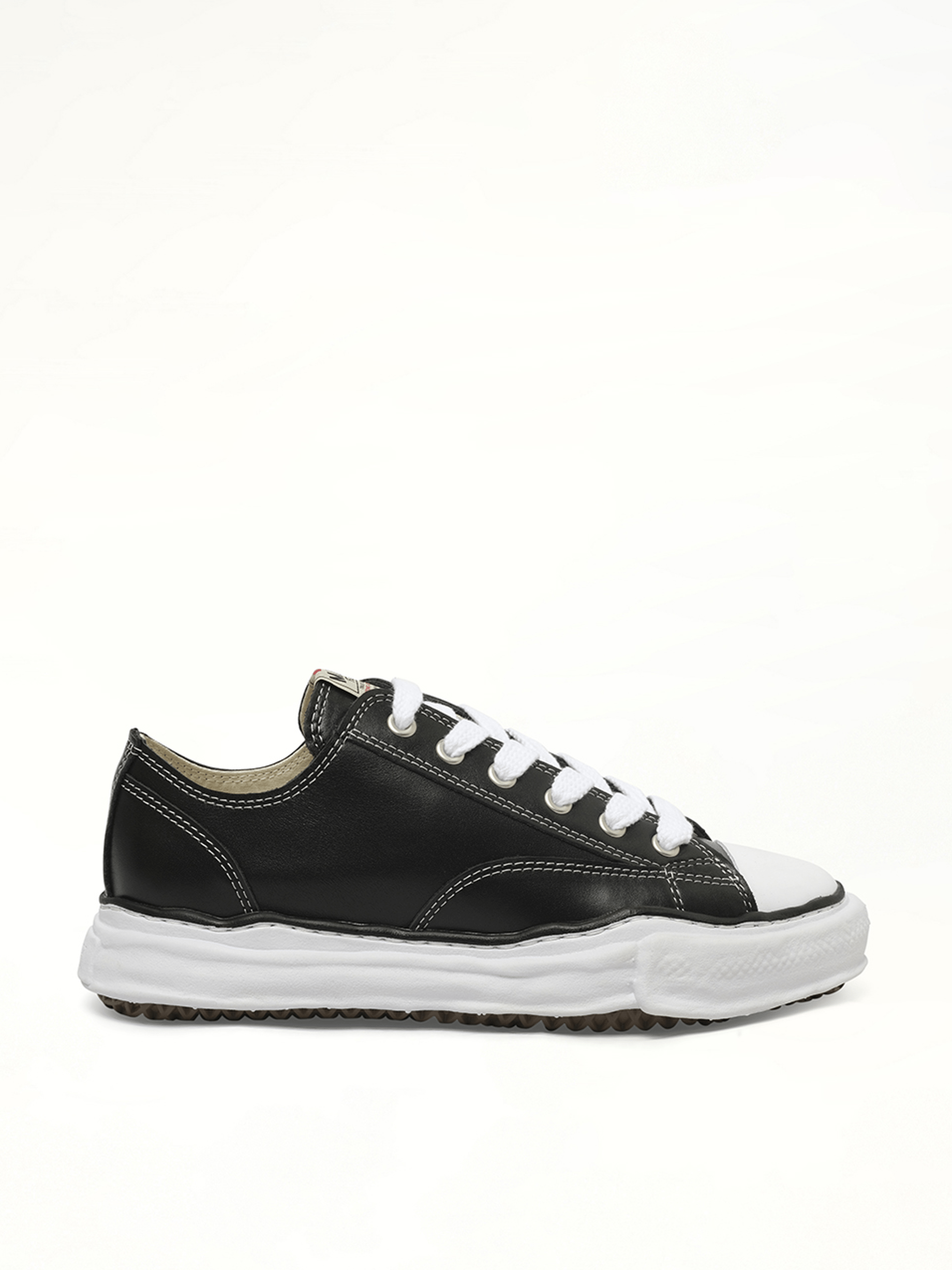 Peterson OG Leather Low Sneaker in Black/White Side View | MAISON MIHARA YASUHIRO