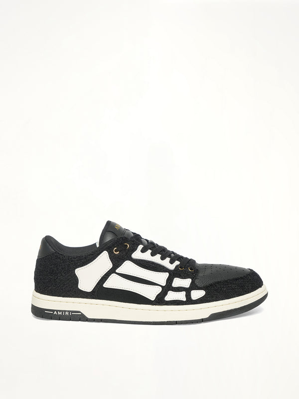 Boucle Skeleton Low Top Sneaker in Black Side View | AMIRI