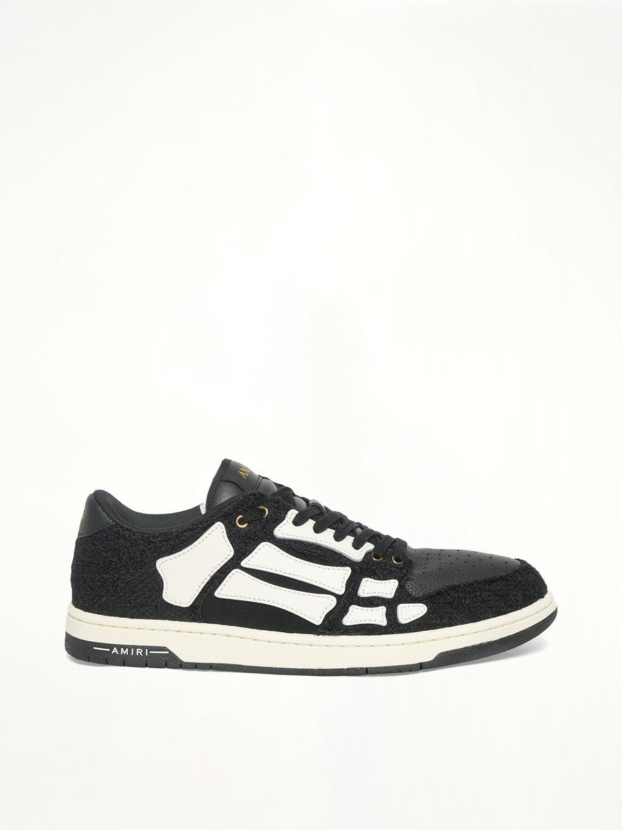 Boucle Skeleton Low Top Sneaker in Black Side View | AMIRI