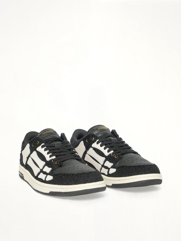 Boucle Skeleton Low Top Sneaker in Black Front View | AMIRI