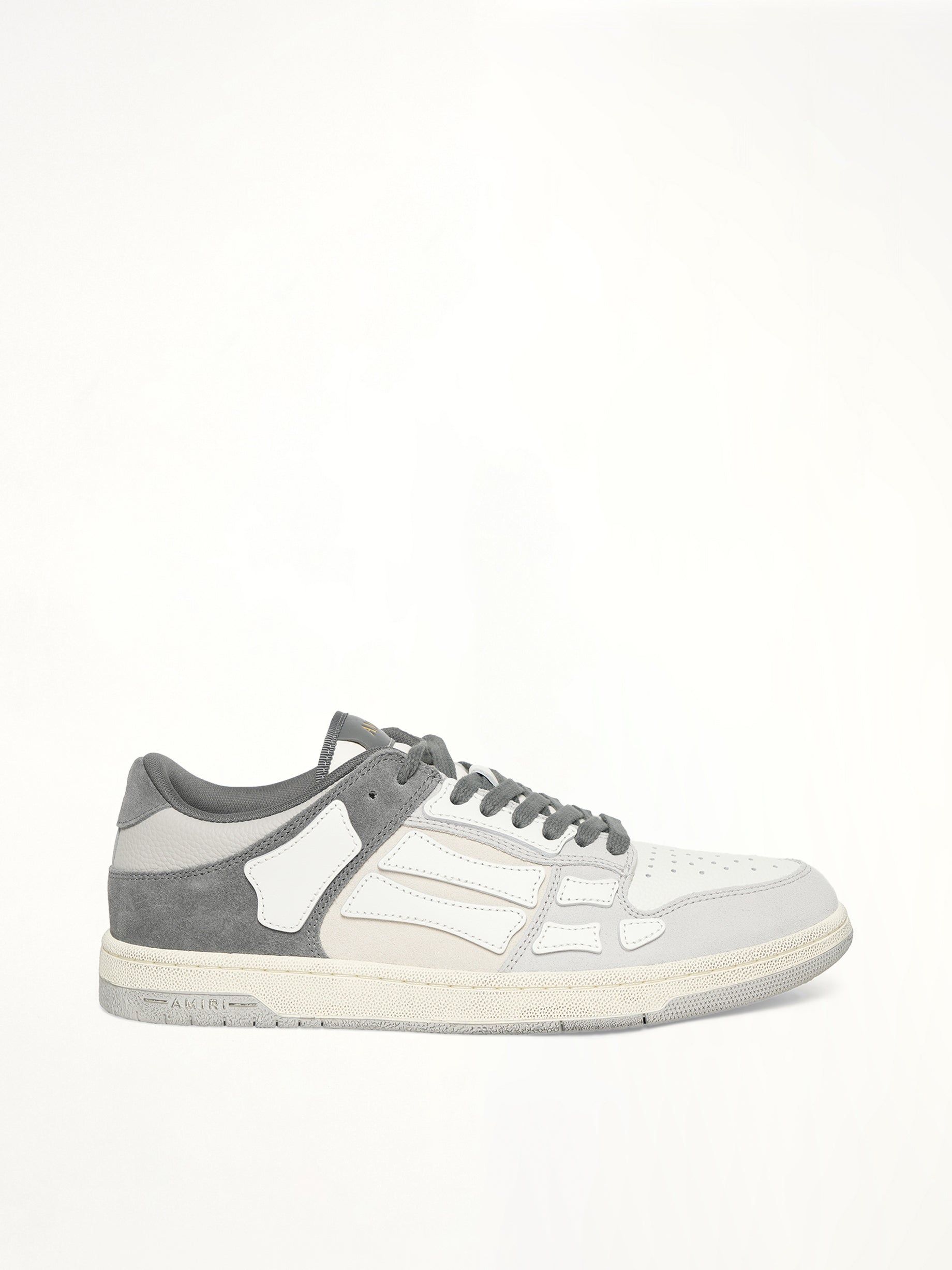 Distressed Skeleton Low Top Sneaker in Dark Grey Side View | AMIRI