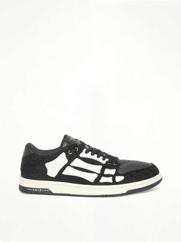 Boucle Skeleton Low Top Sneaker in Black Side View | AMIRI