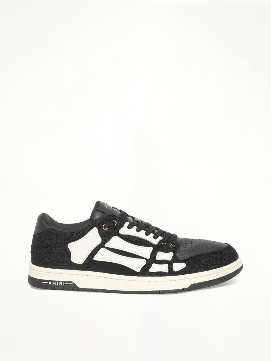 Boucle Skeleton Low Top Sneaker in Black Side View | AMIRI