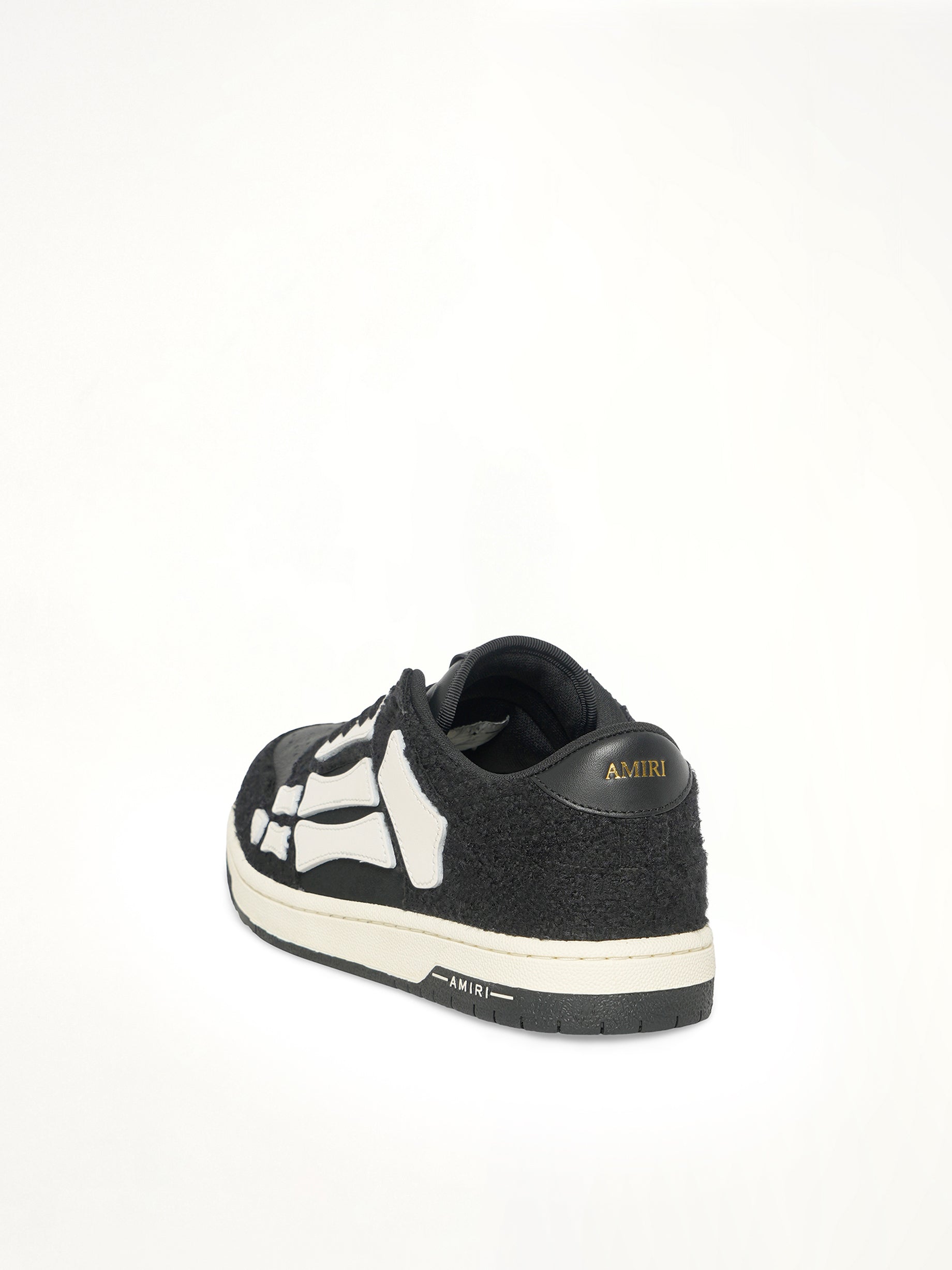 Boucle Skeleton Low Top Sneaker in Black Back View | AMIRI
