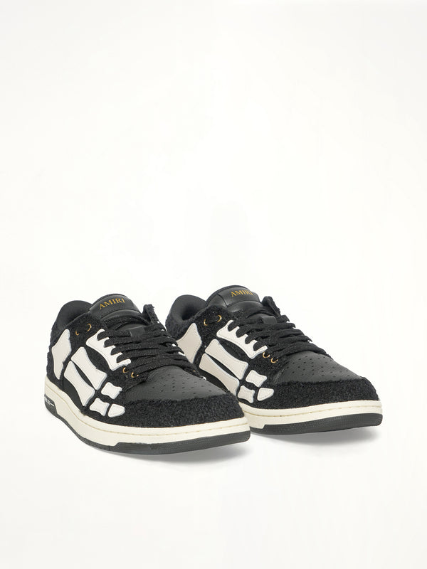 Boucle Skeleton Low Top Sneaker in Black Front View | AMIRI