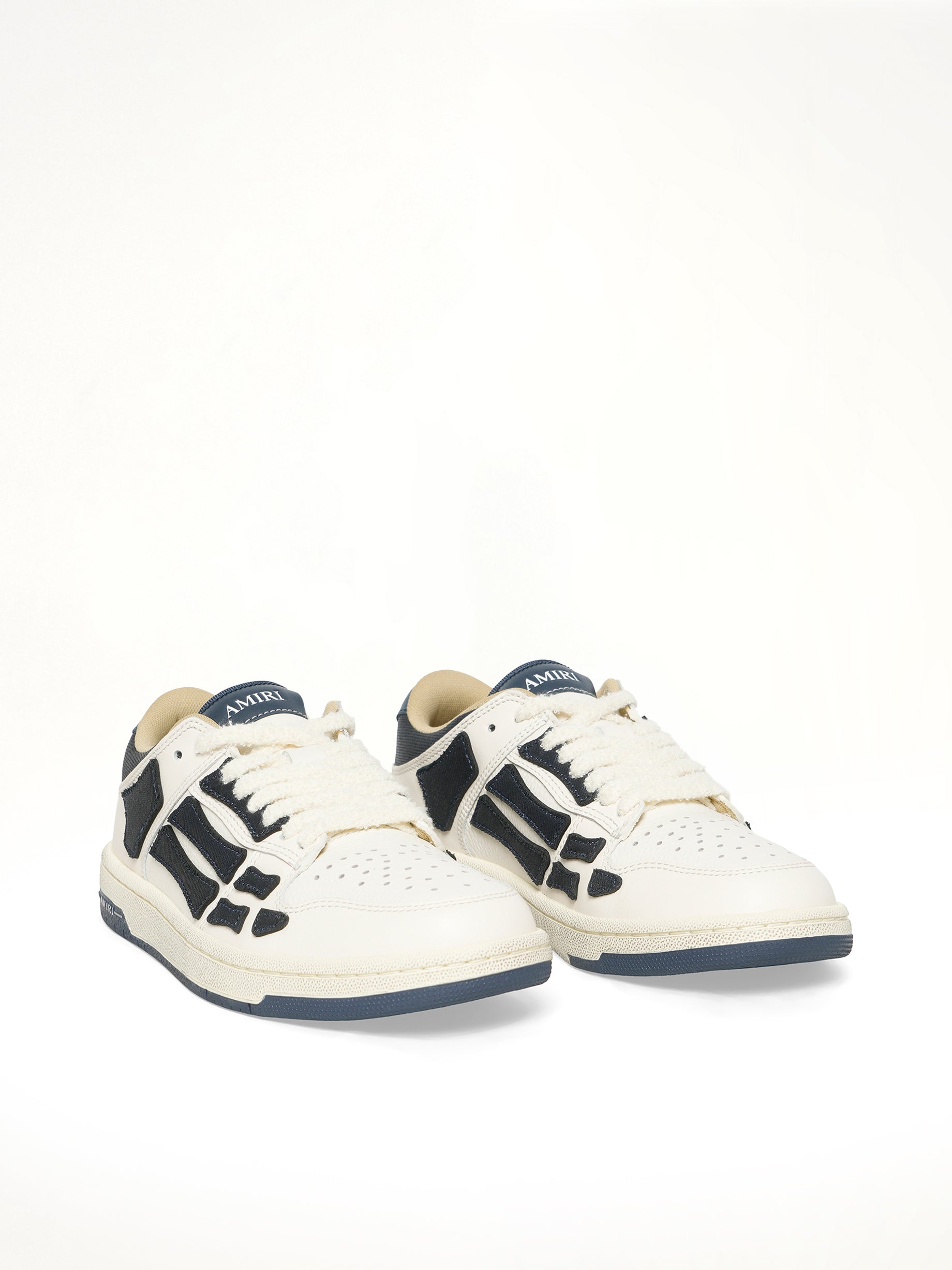 Denim Skeleton Low Top Sneakers in Wet Shimmer Front View | AMIRI