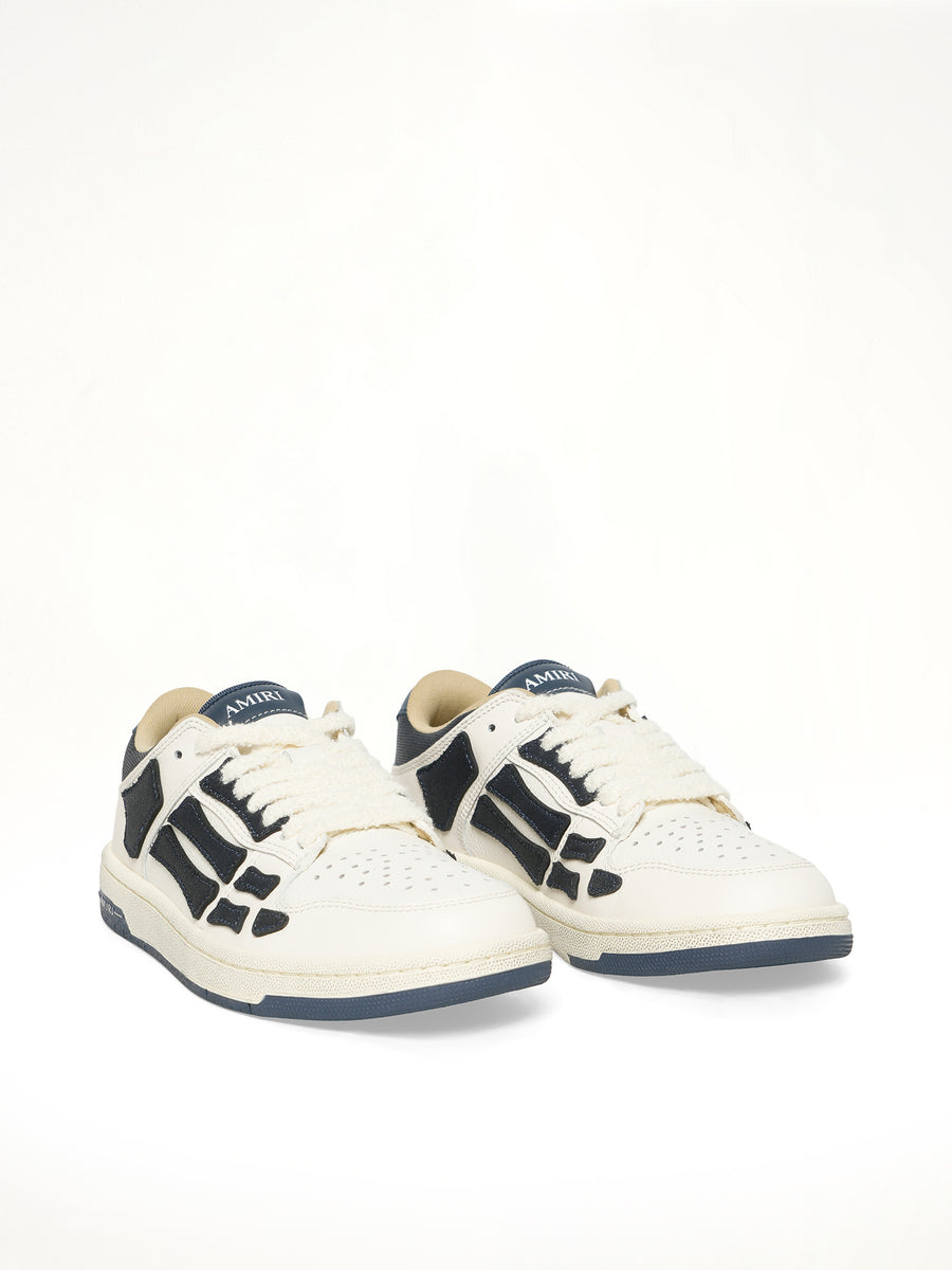 Denim Skeleton Low Top Sneakers in Wet Shimmer Front View | AMIRI