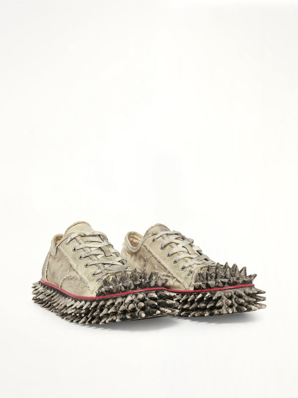 Dirty Spike Toe Cap Canvas Sneaker in White Front View | DOUBLET