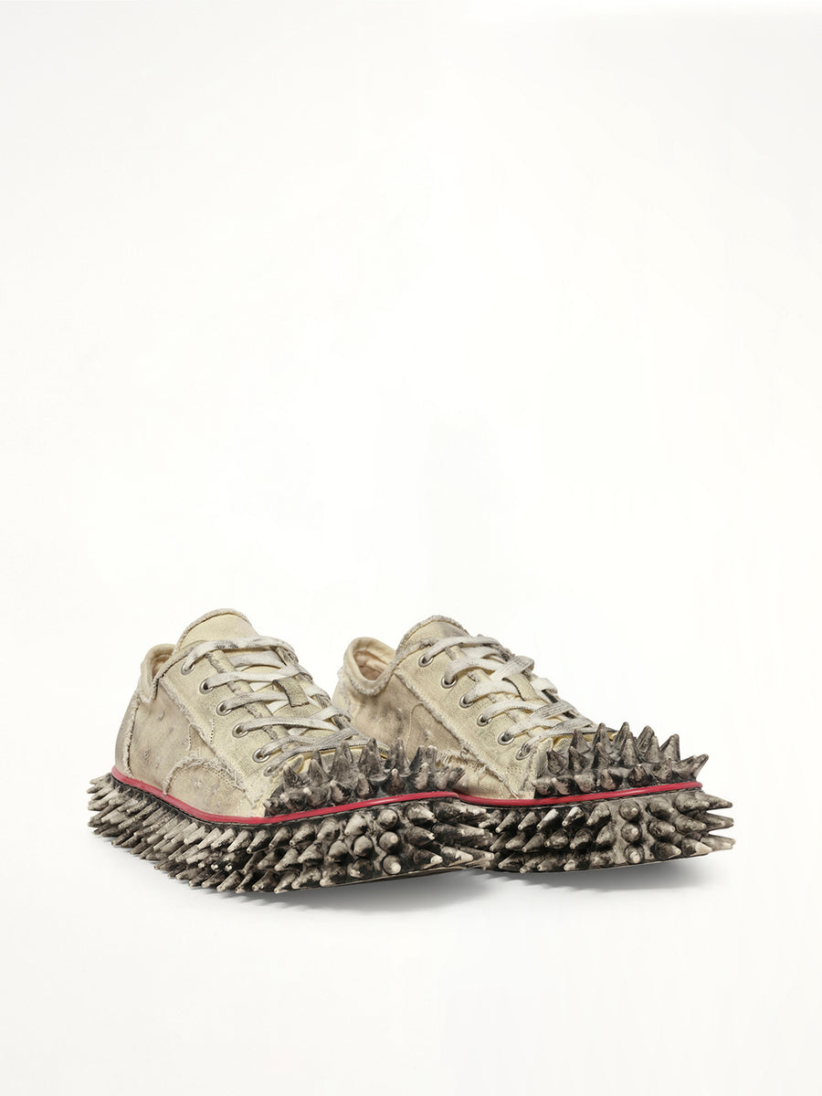 Dirty Spike Toe Cap Canvas Sneaker in White Front View | DOUBLET