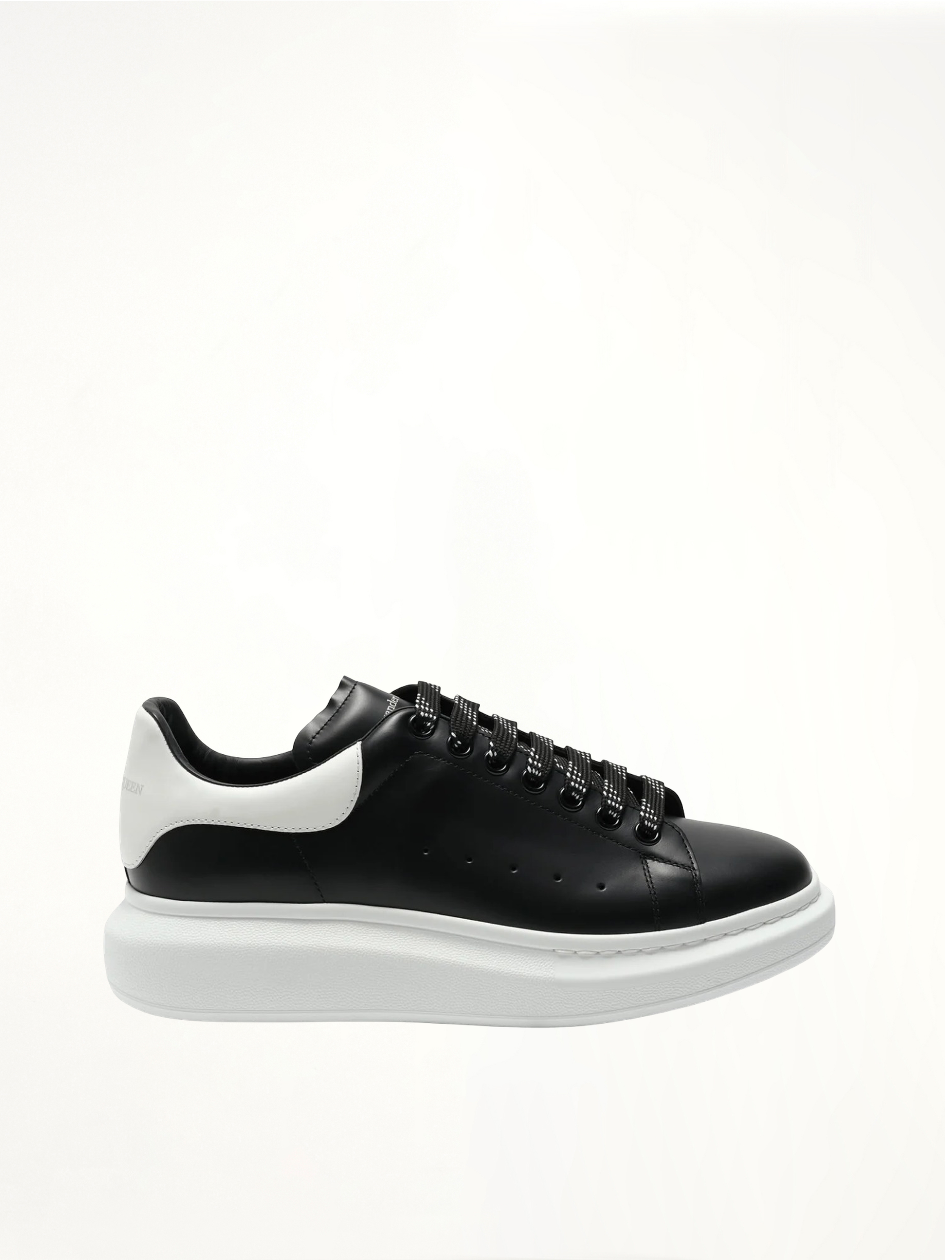 Larry Oversized Sneaker in Black/White Side View | ALEXANDER MCQUEEN