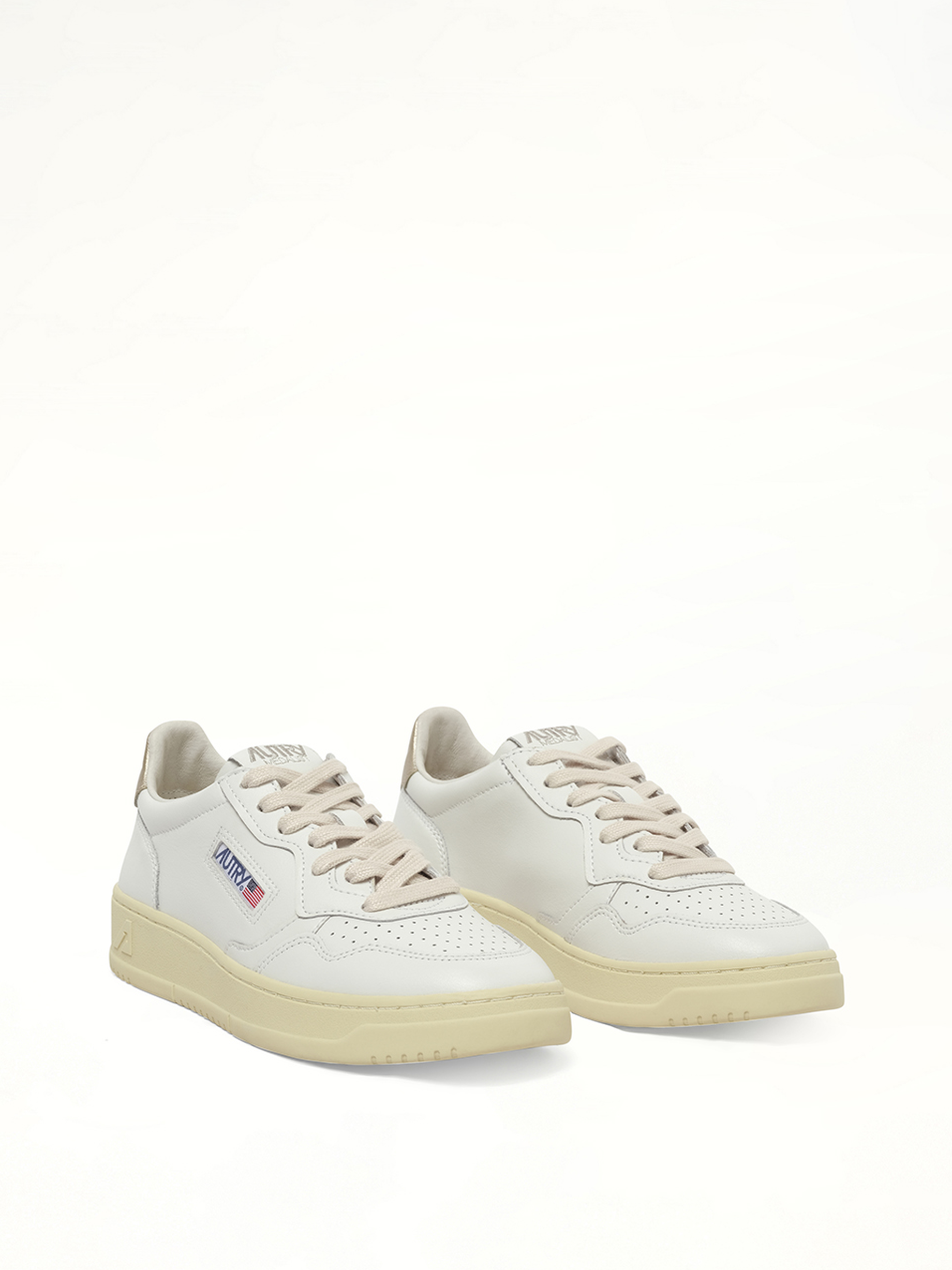 Medalist Low Sneakers in White/Gold Front View | AUTRY