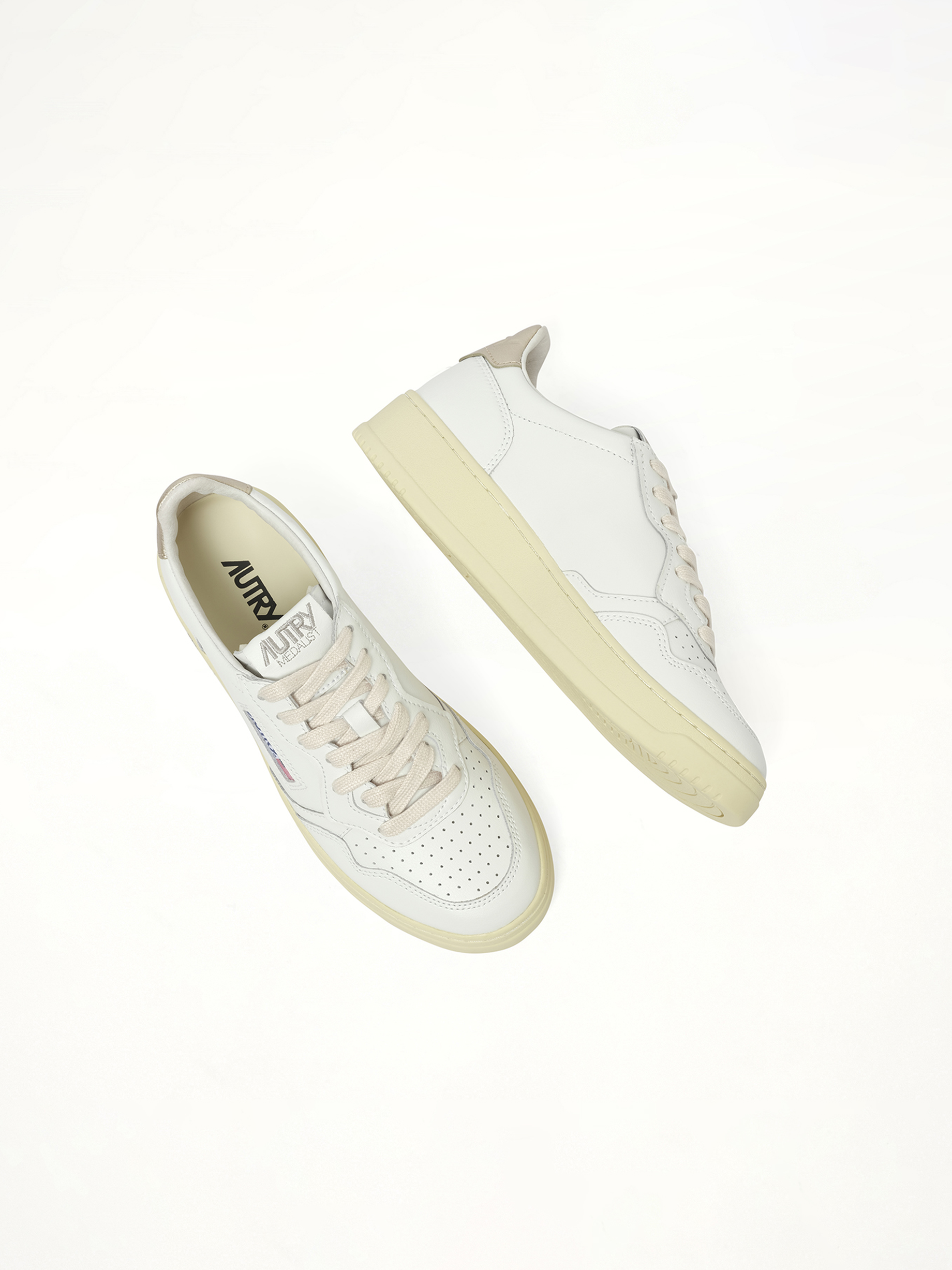 Medalist Low Sneakers in White/Gold Back View | AUTRY