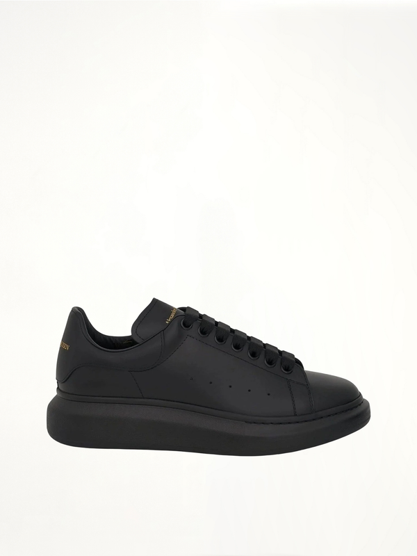 Larry Oversized Rubber Sneaker in Black Side View | ALEXANDER MCQUEEN