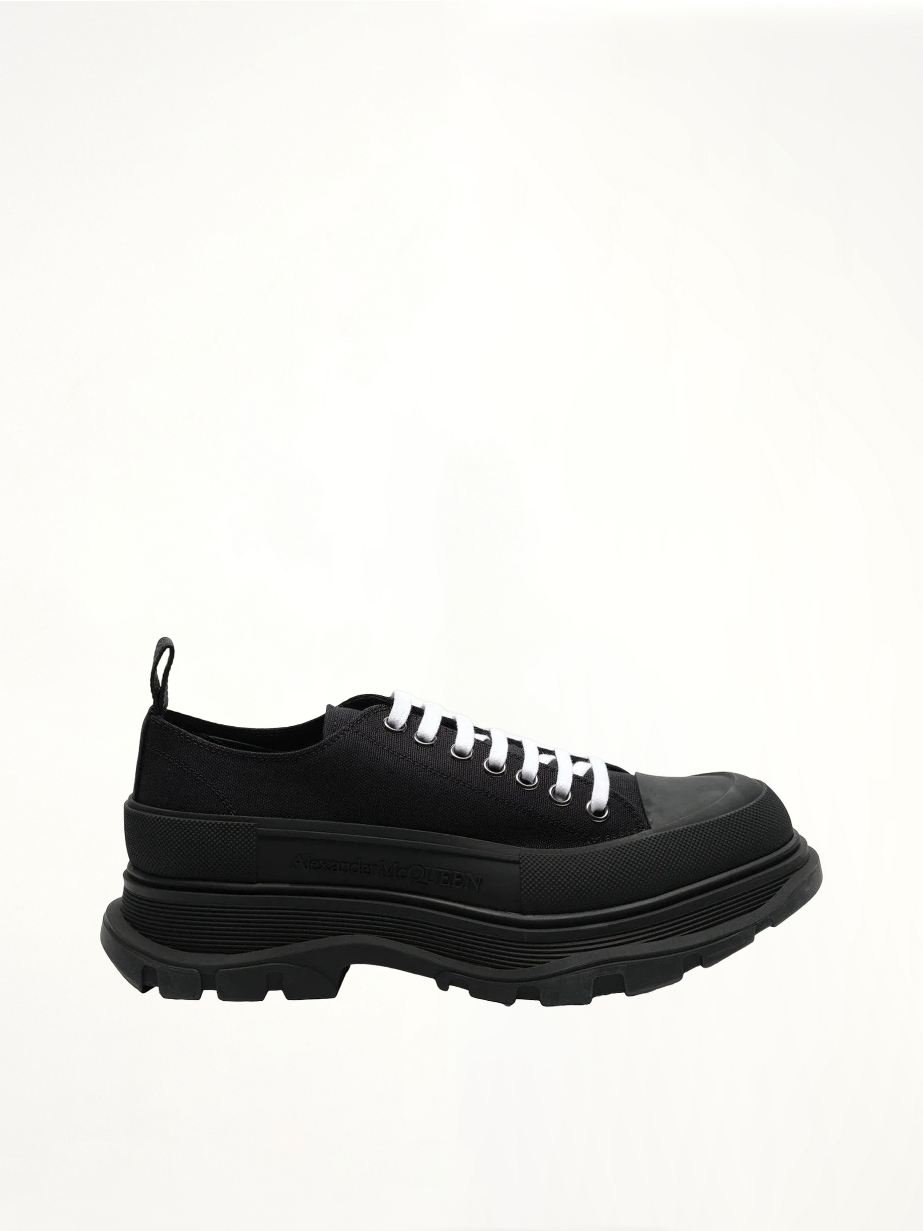 Tread Slick Canvas Lace-Up Shoes in Black Side View | ALEXANDER MCQUEEN