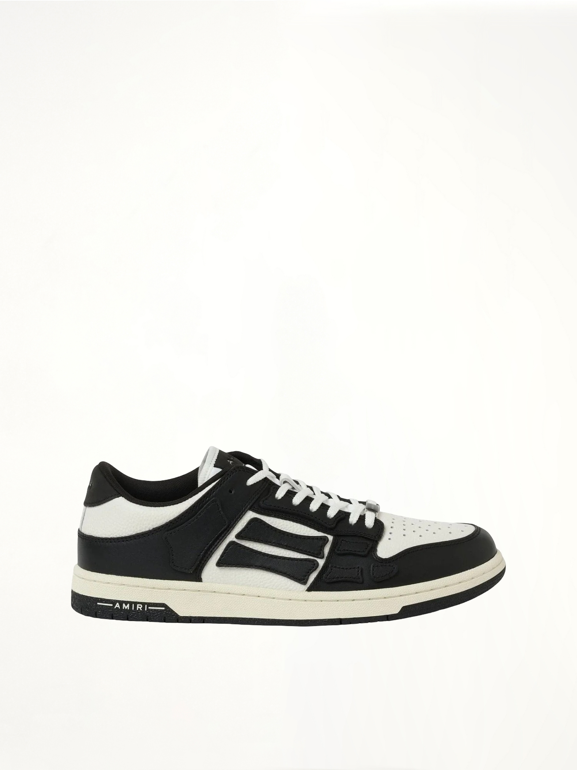 Skeleton Low Sneaker in Black/White Side View | AMIRI