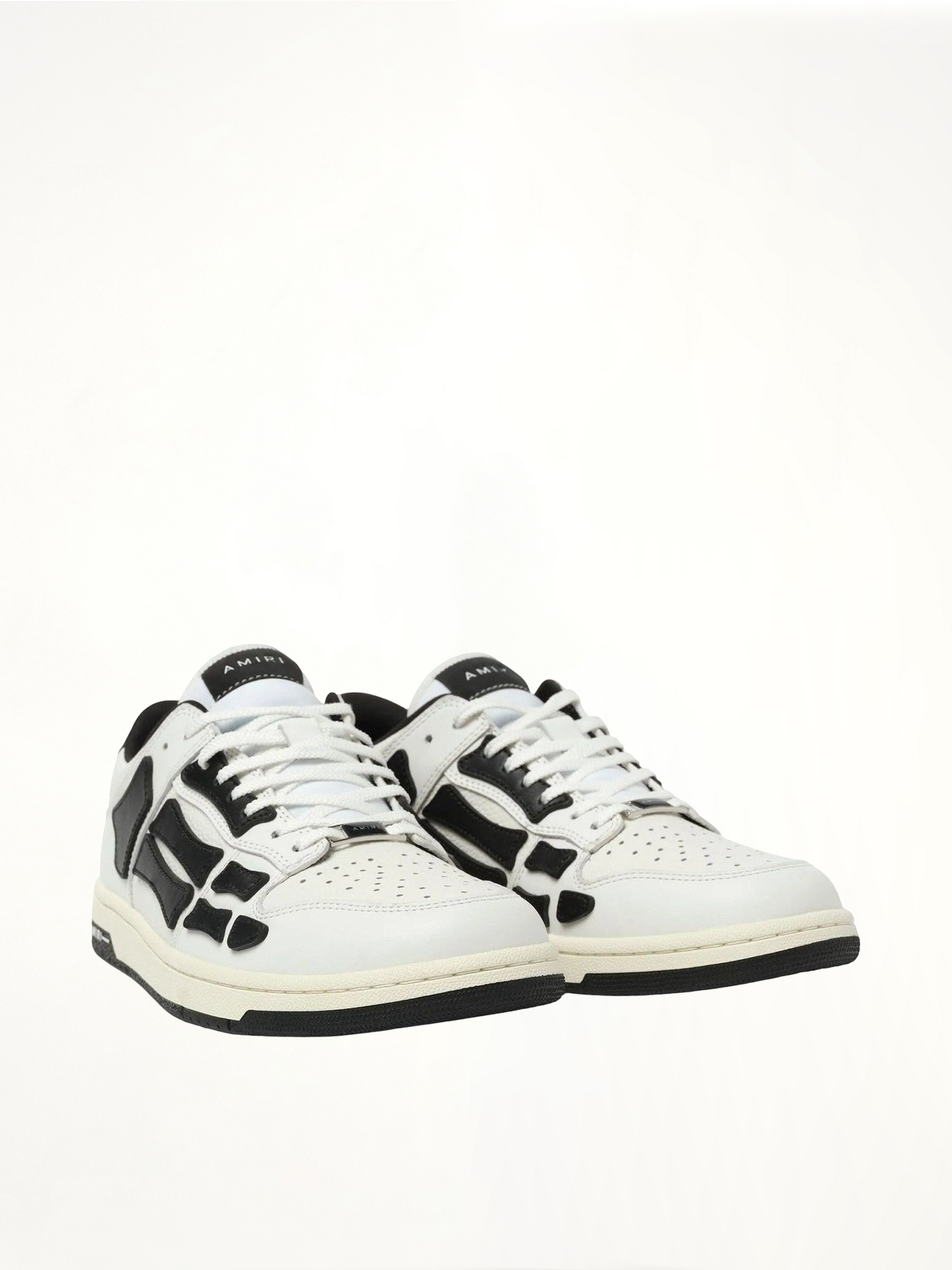 Skeleton Low Sneaker in White/Black Front View | AMIRI
