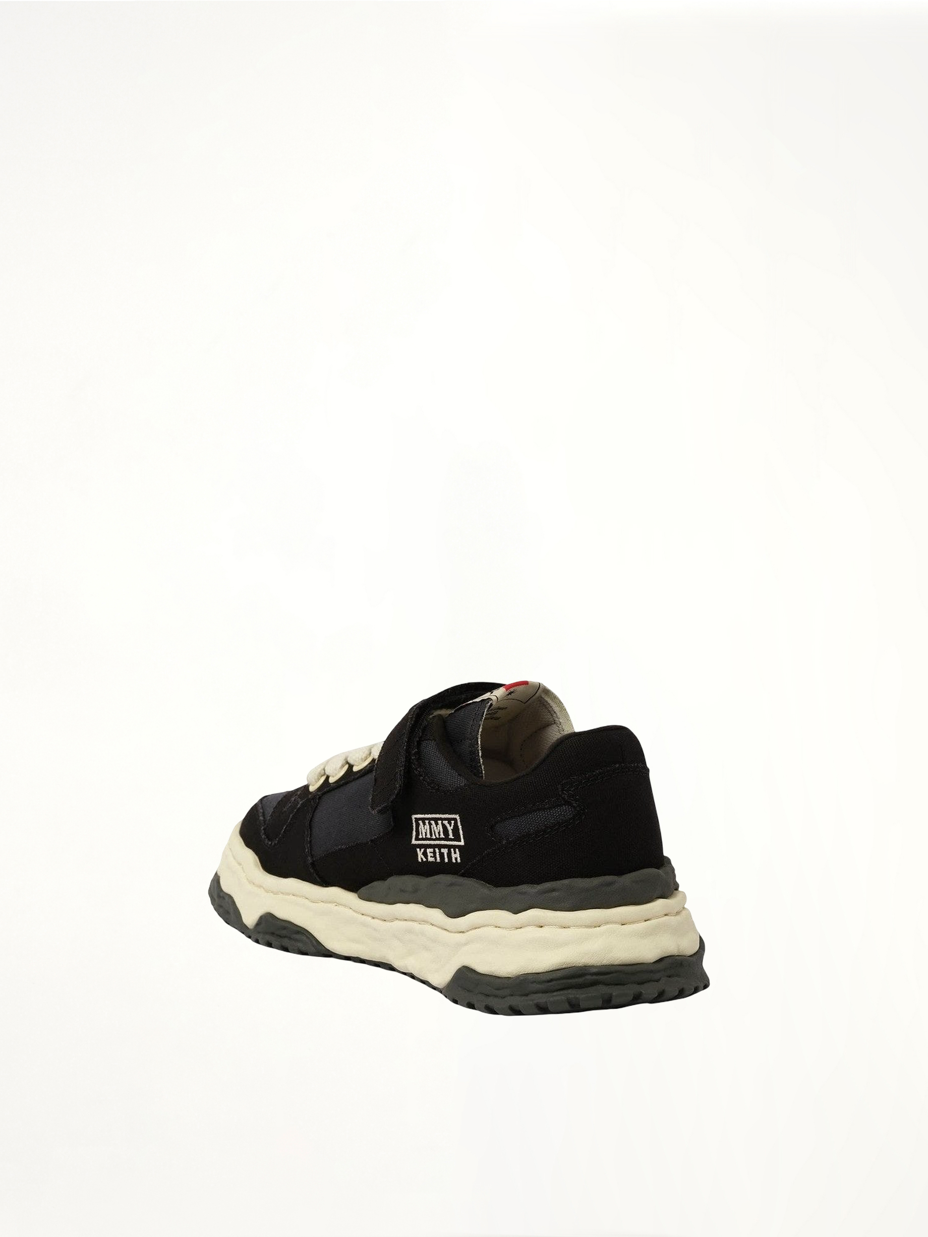 KEITH OG Low Top Sneaker in Black/White Back View | MAISON MIHARA YASUHIRO