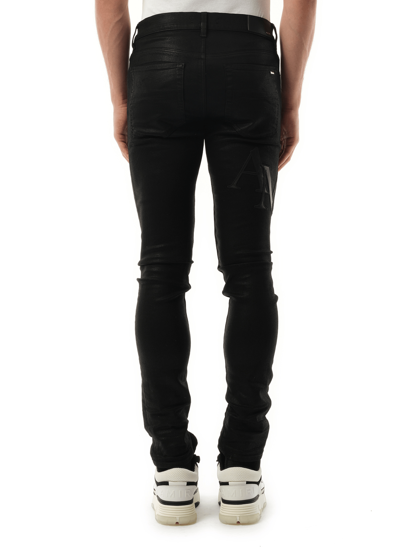 Amiri Waxed Staggered Logo Skinny Jeans in Black Wax