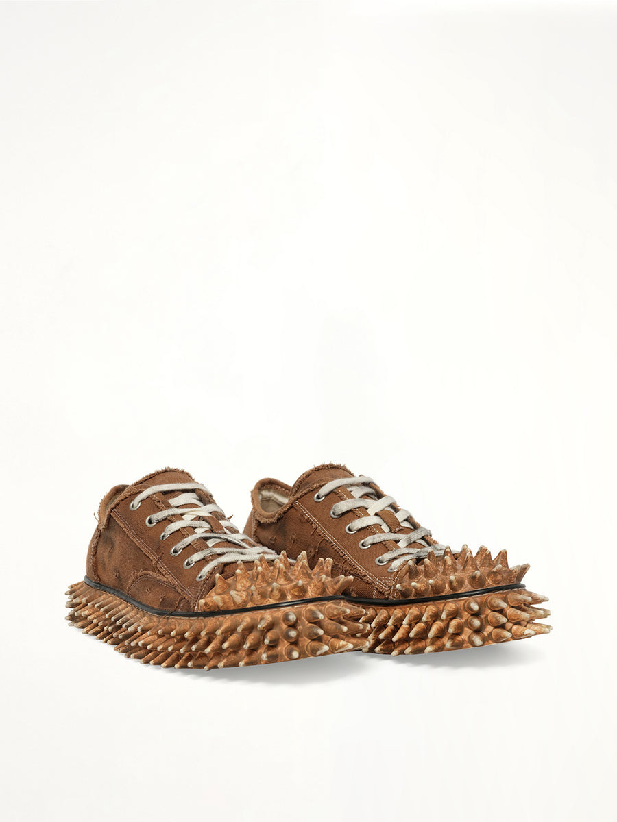 Dirty Spike Toe Cap Canvas Sneaker in Brown Front View | DOUBLET