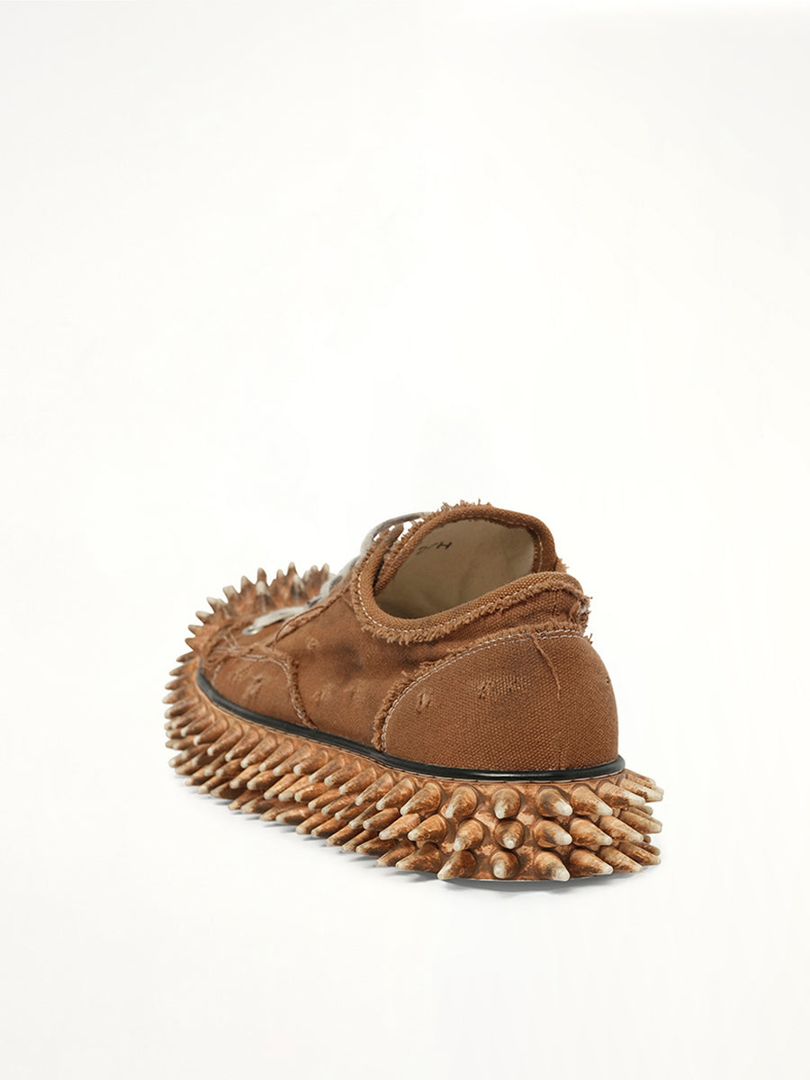 Dirty Spike Toe Cap Canvas Sneaker in Brown Back View | DOUBLET