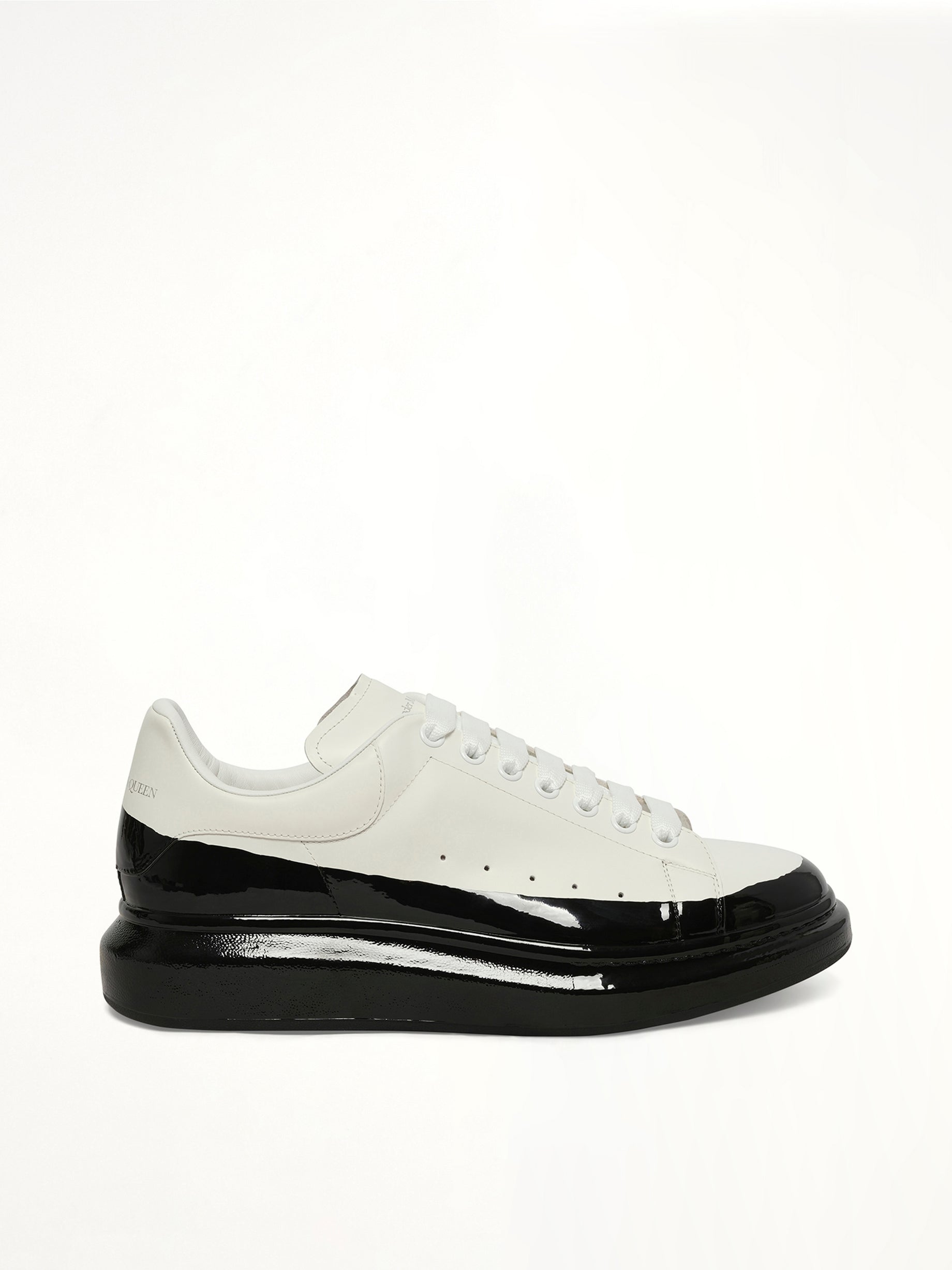 Larry Oversized Dipped Sneaker in White/Black Side View | ALEXANDER MCQUEEN