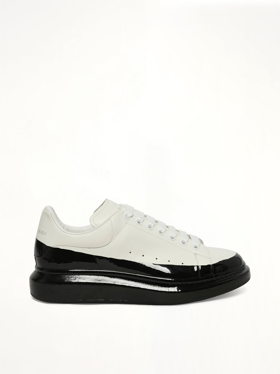 Larry Oversized Dipped Sneaker in White/Black Side View | ALEXANDER MCQUEEN