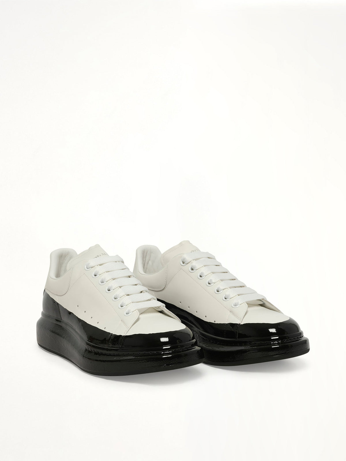 Larry Oversized Dipped Sneaker in White/Black Front View | ALEXANDER MCQUEEN
