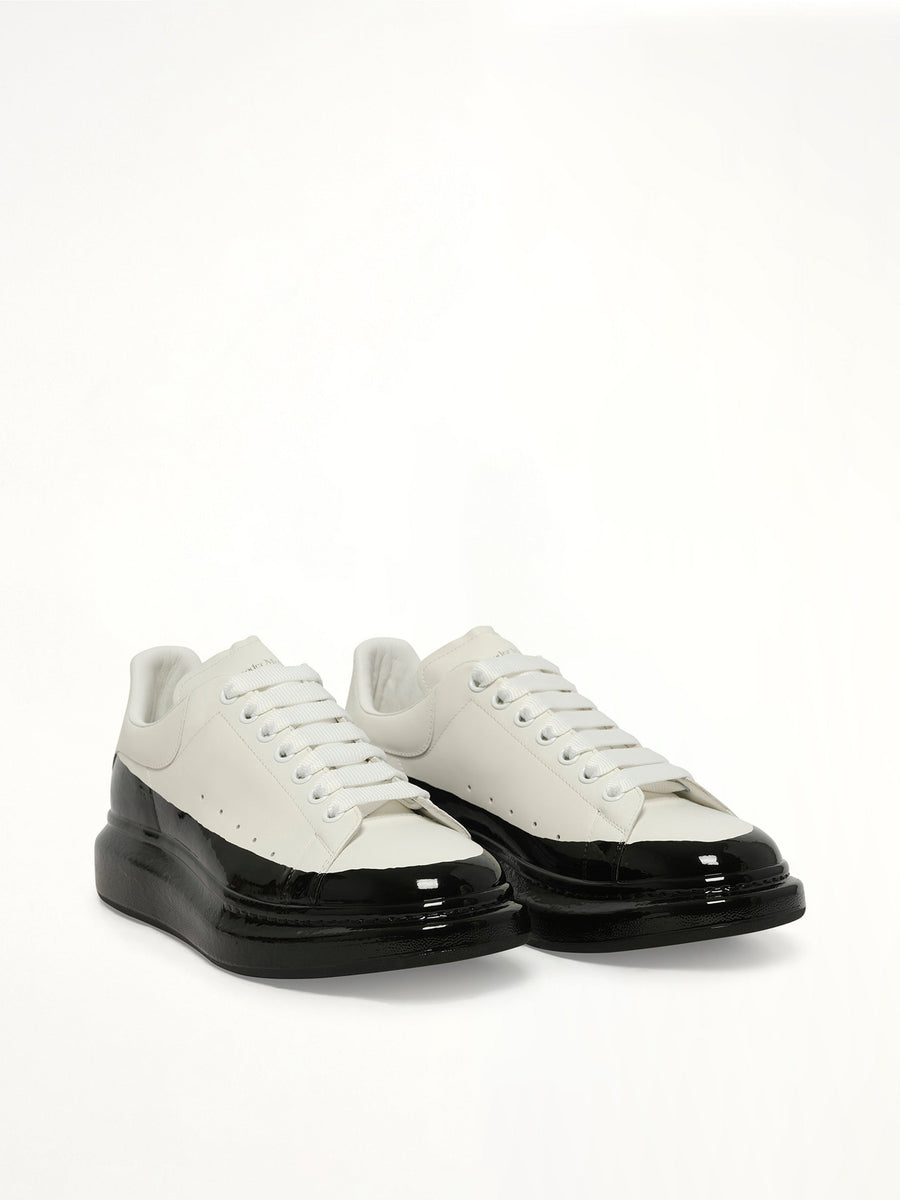 Larry Oversized Dipped Sneaker in White/Black Front View | ALEXANDER MCQUEEN