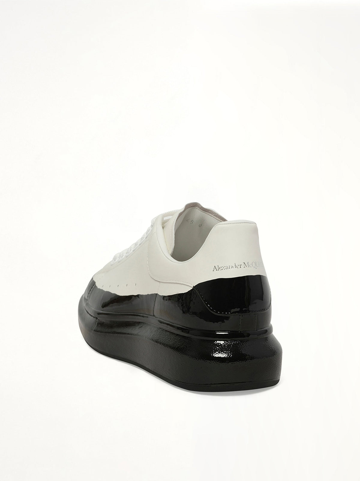 Larry Oversized Dipped Sneaker in White/Black Back View | ALEXANDER MCQUEEN