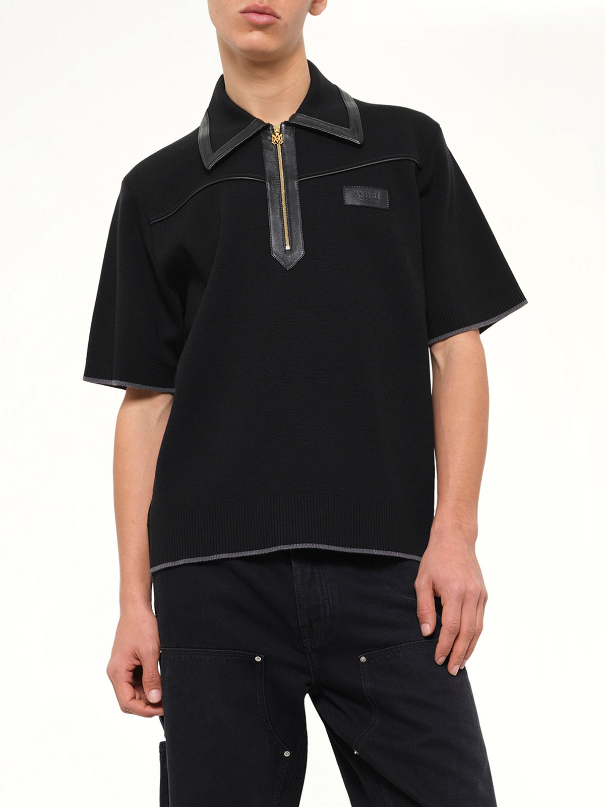 Leather Trim Knit Zipped Polo in Black