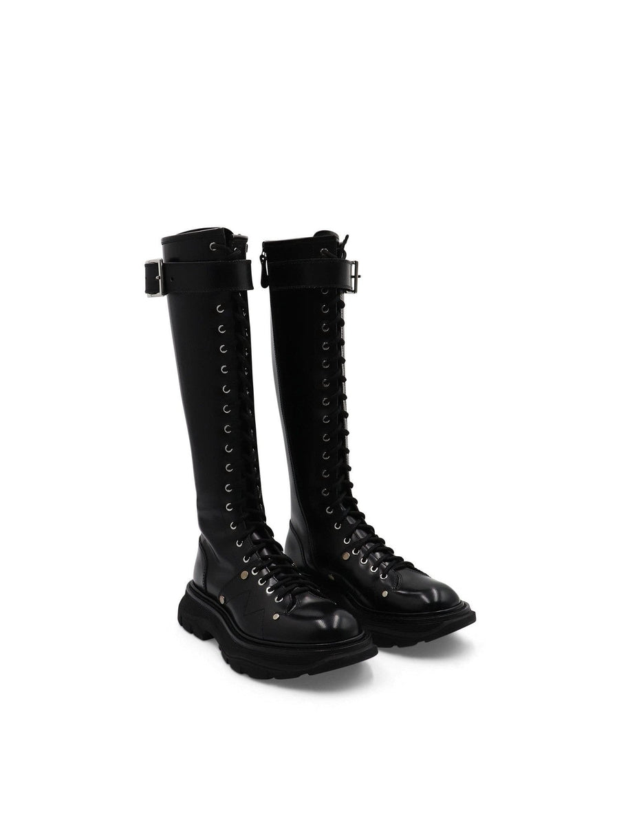 Tread Knee High Lace Up Boots in Black Front View | ALEXANDER MCQUEEN