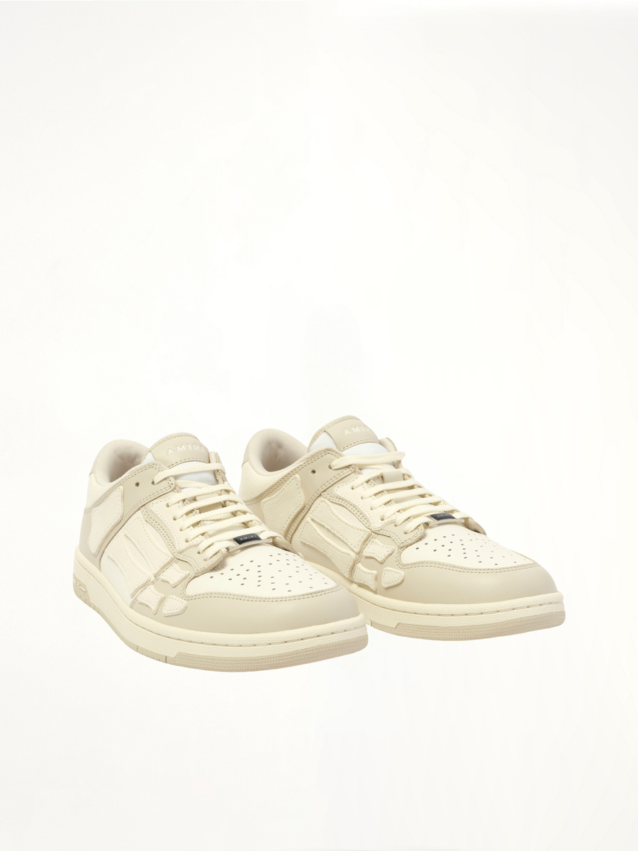 Skeleton Low Top Sneaker in Alabaster Front View | AMIRI