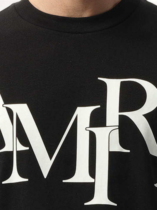 Amiri Staggered Logo T-Shirt in Black