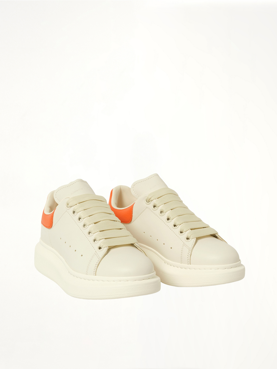 Larry Oversized Sneaker in Off White/Orange Front View | ALEXANDER MCQUEEN
