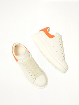 Larry Oversized Sneaker in Off White/Orange Top View | ALEXANDER MCQUEEN