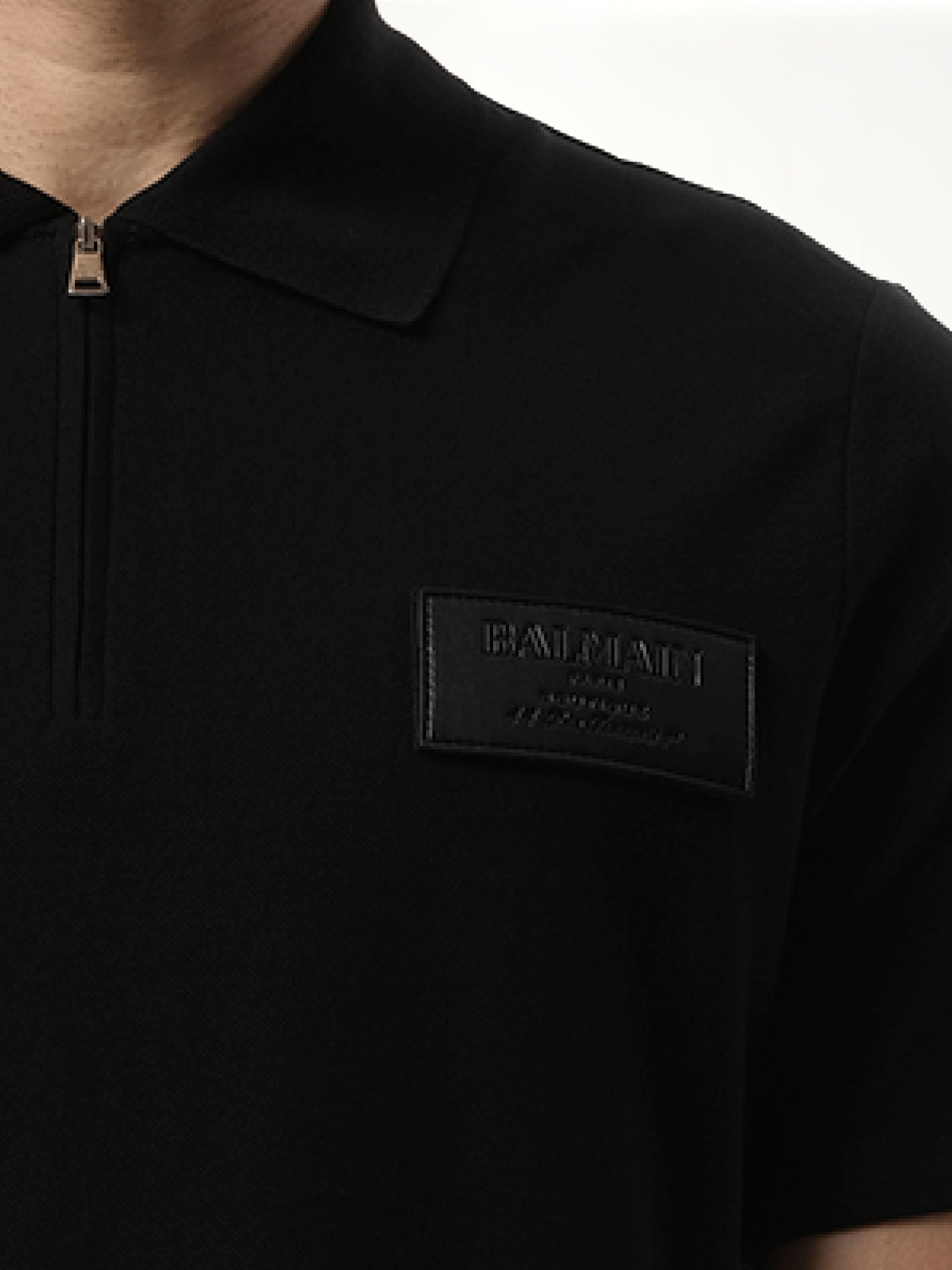 Small Leather Couture Label Zipped Polo in Black