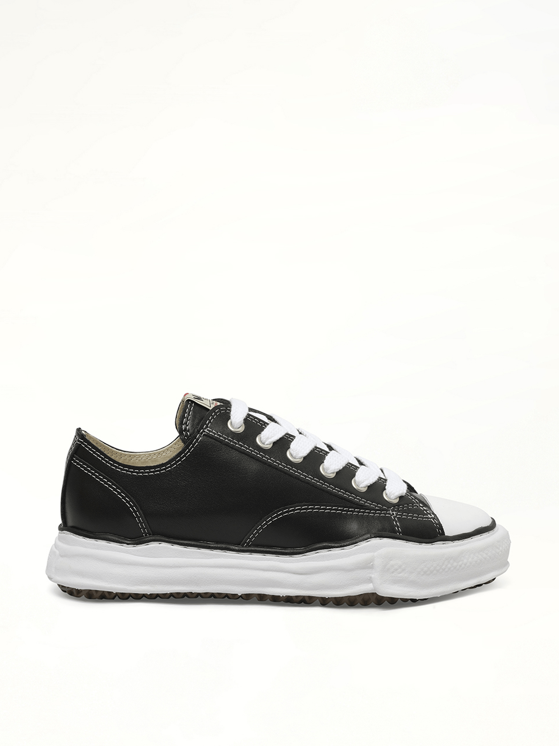 Peterson OG Leather Low Sneaker in Black/White Side View | MAISON MIHARA YASUHIRO