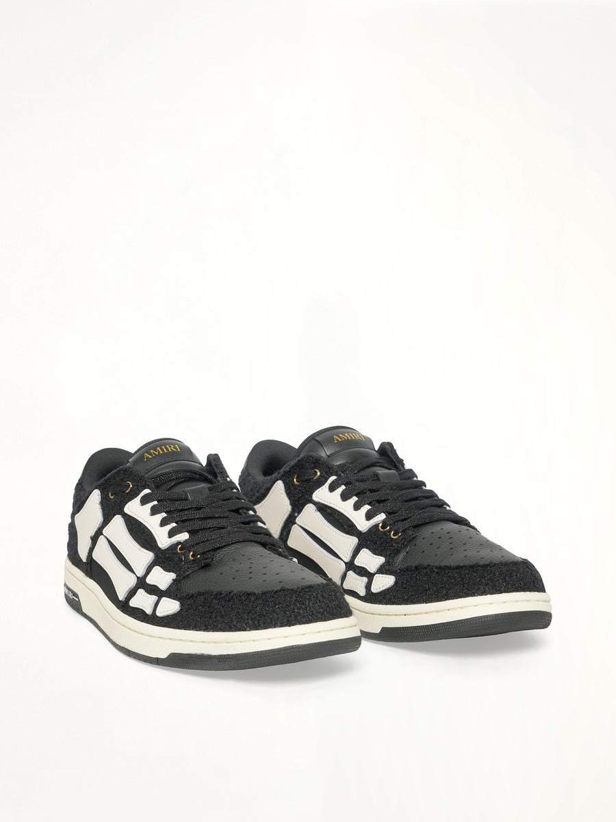 Boucle Skeleton Low Top Sneaker in Black Front View | AMIRI