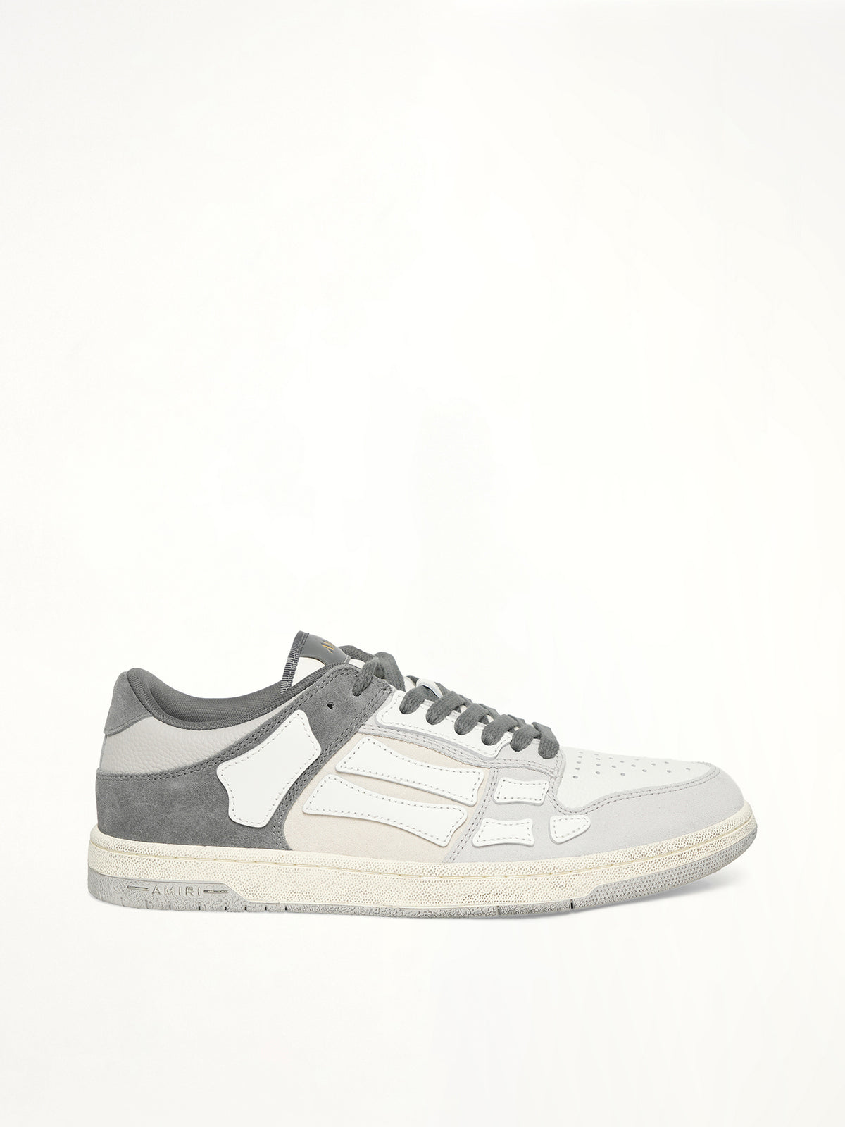 Distressed Skeleton Low Top Sneaker in Dark Grey Side View | AMIRI