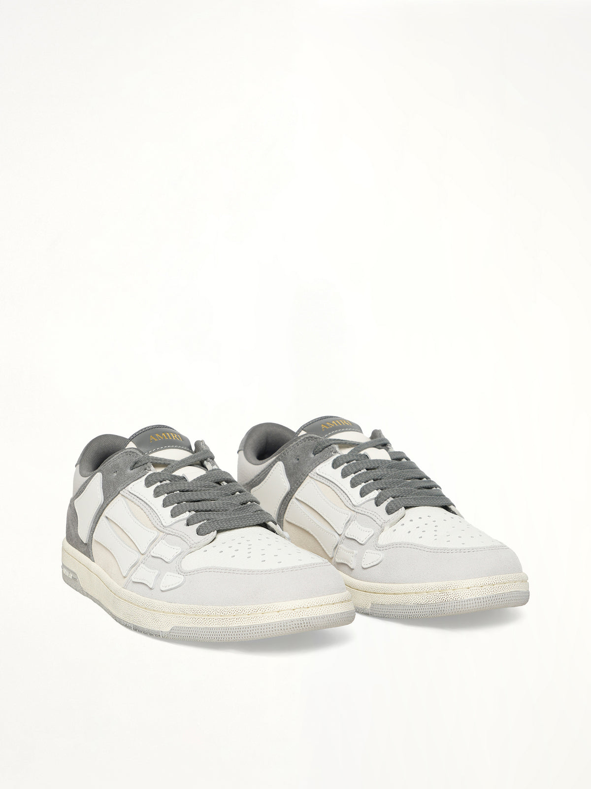 Distressed Skeleton Low Top Sneaker in Dark Grey Front View | AMIRI