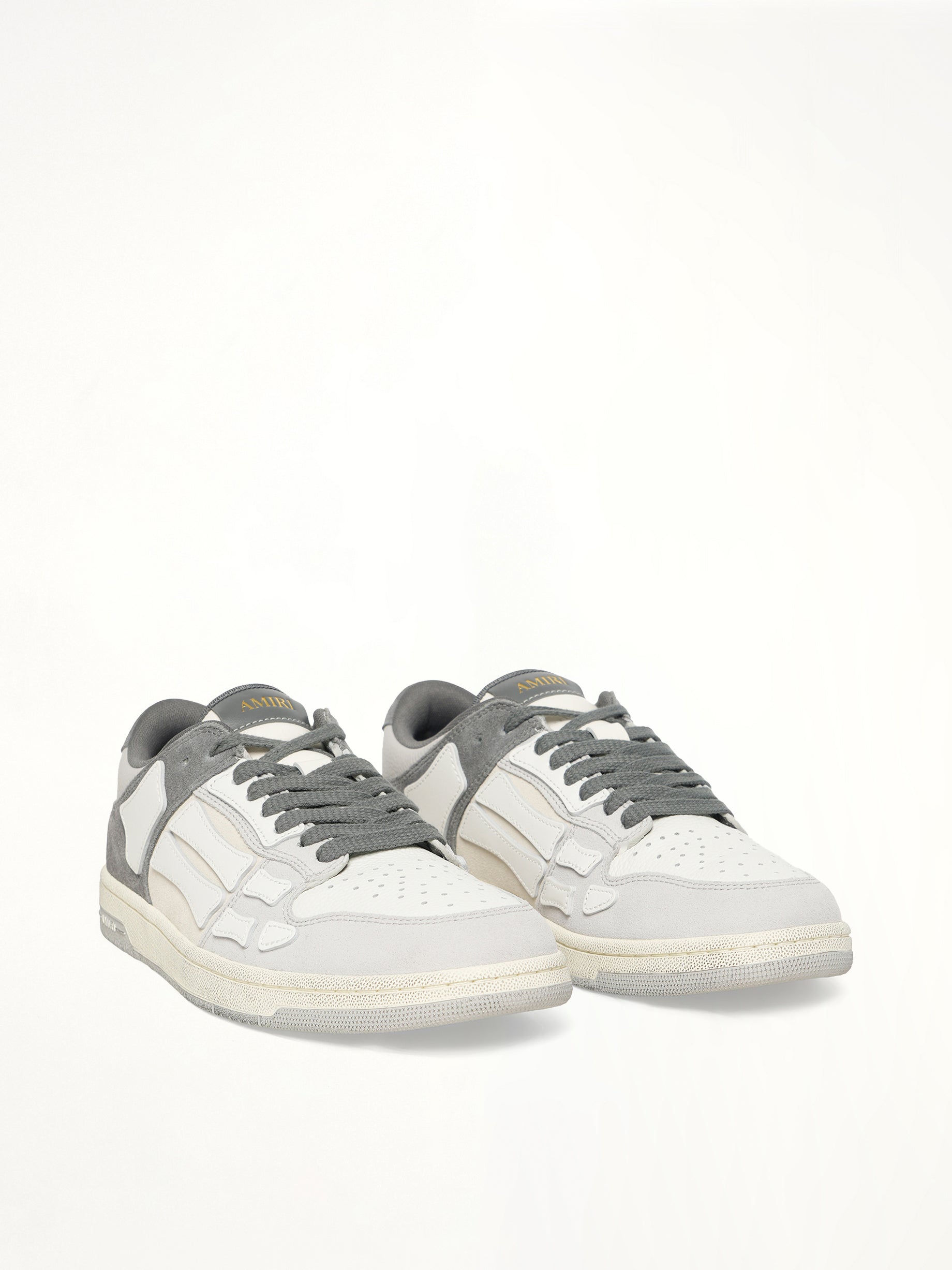 Distressed Skeleton Low Top Sneaker in Dark Grey Front View | AMIRI