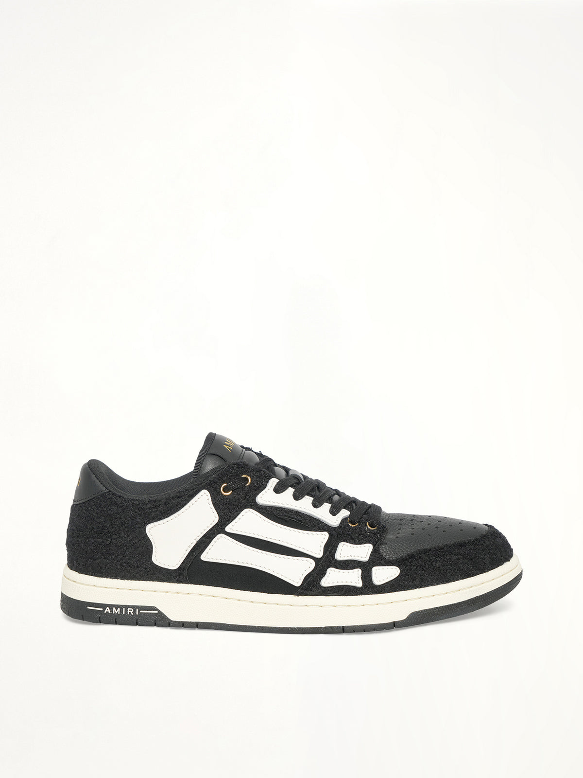 Boucle Skeleton Low Top Sneaker in Black Side View | AMIRI