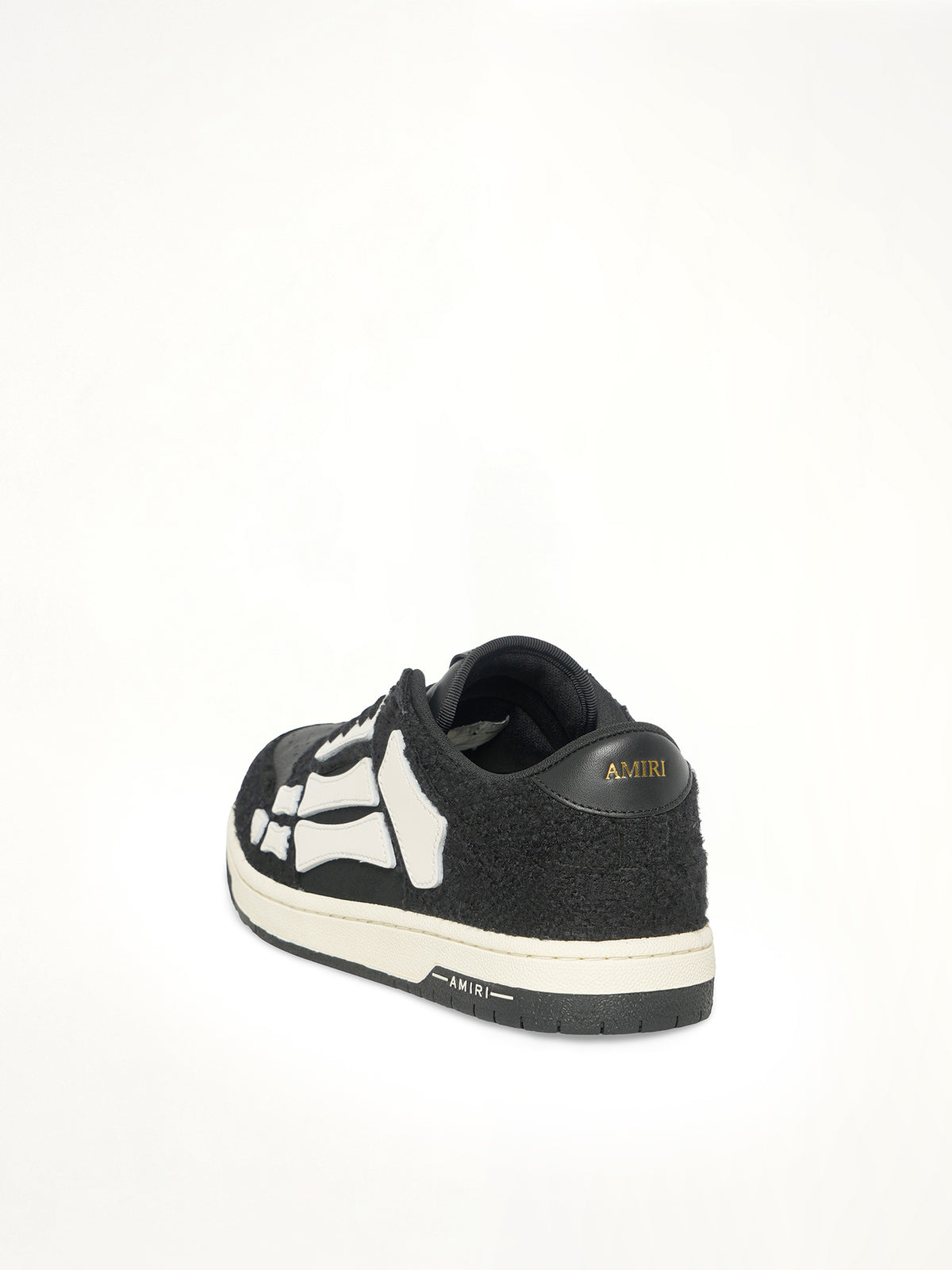 Boucle Skeleton Low Top Sneaker in Black Back View | AMIRI