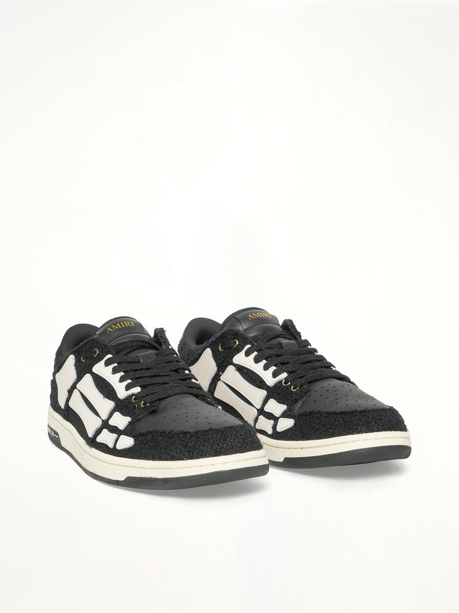 Boucle Skeleton Low Top Sneaker in Black Front View | AMIRI