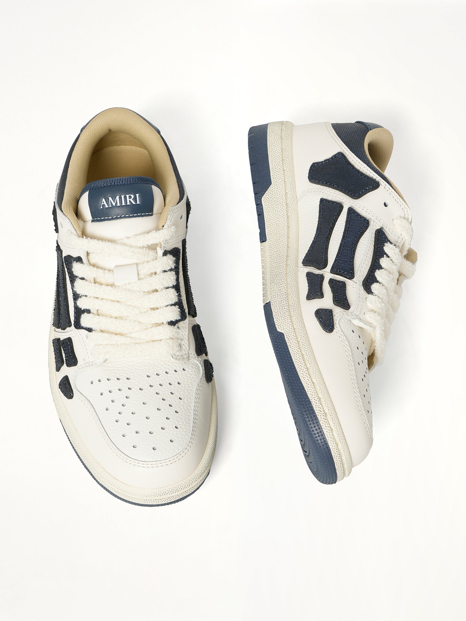Denim Skeleton Low Top Sneakers in Wet Shimmer Top View | AMIRI