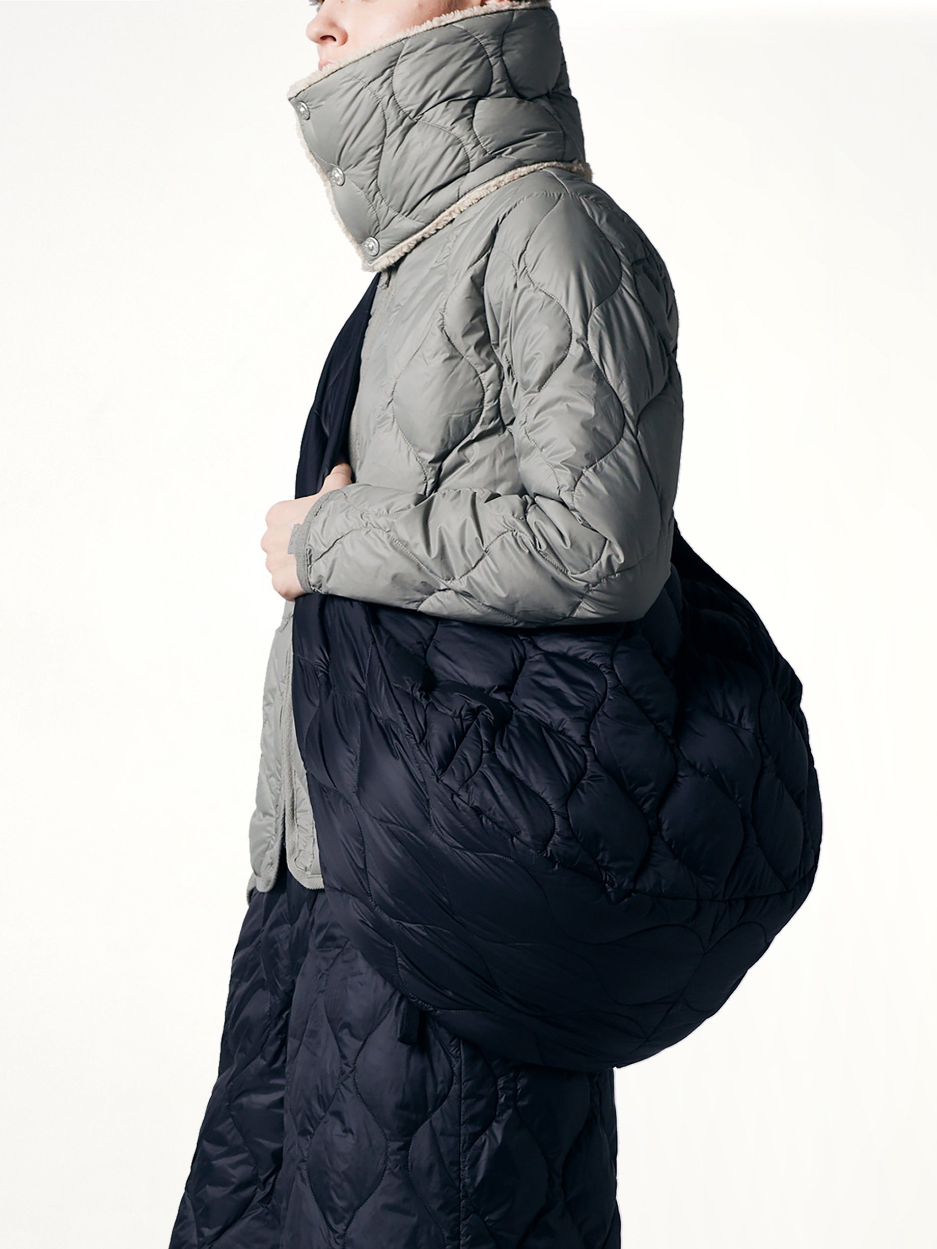 TAION Military Banana Shoulder Down Bag L in Black Back View from MARAIS