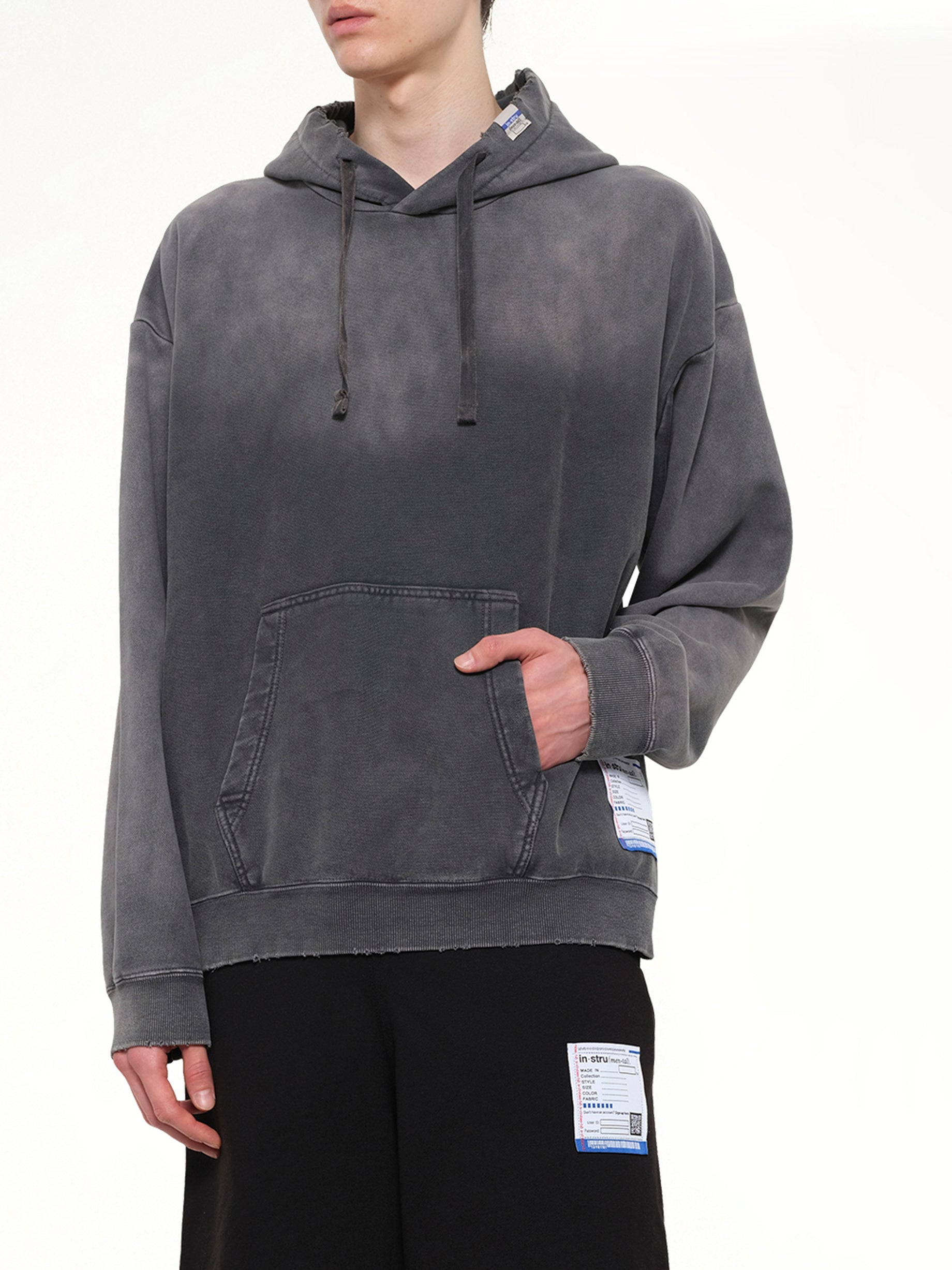 MAISON MIHARA YASUHIRO Instrumental French Terry Distressed Hoodie in Black Detail Shot from MARAIS