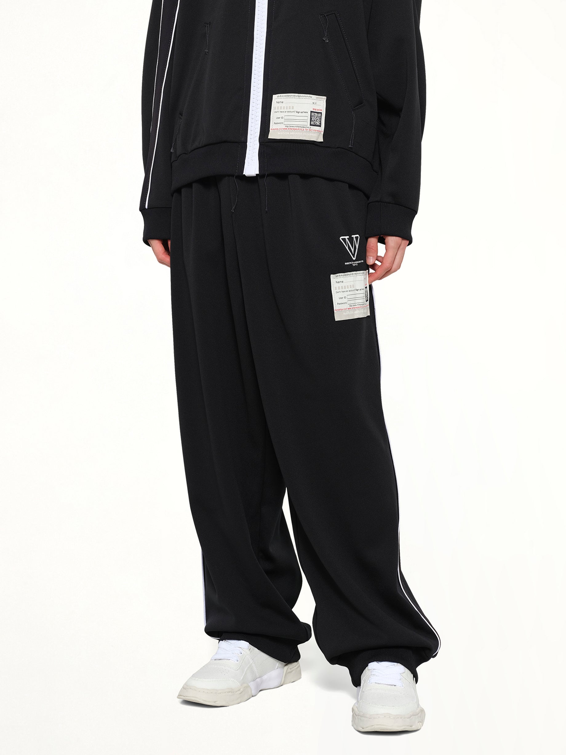 MAISON MIHARA YASUHIRO Amateur Sewn Track Pants in Black Detail Shot from MARAIS