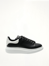 Larry Oversized Sneaker in Black/White Side View | ALEXANDER MCQUEEN