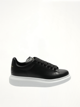 Larry Oversized Sneakers in Black/White Side View | ALEXANDER MCQUEEN